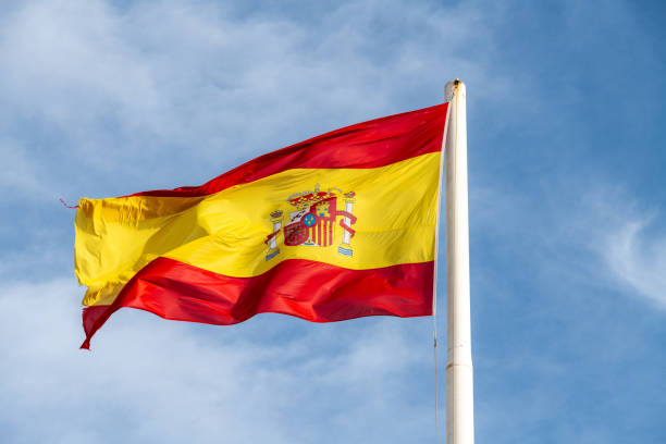 istock Spanish National Flag Waving Against Blue Sky 2032968654