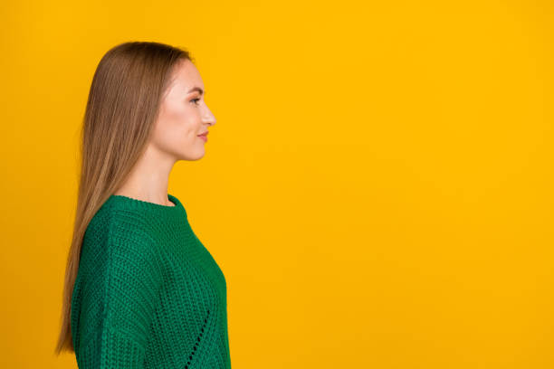 istock Side profile photo of confident brown hair young lady looking empty space proposition update her logo isolated on yellow color background 2033000295