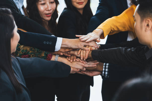 istock Diversity business people putting their hands together. Assemble. Intellectual. 2033003525