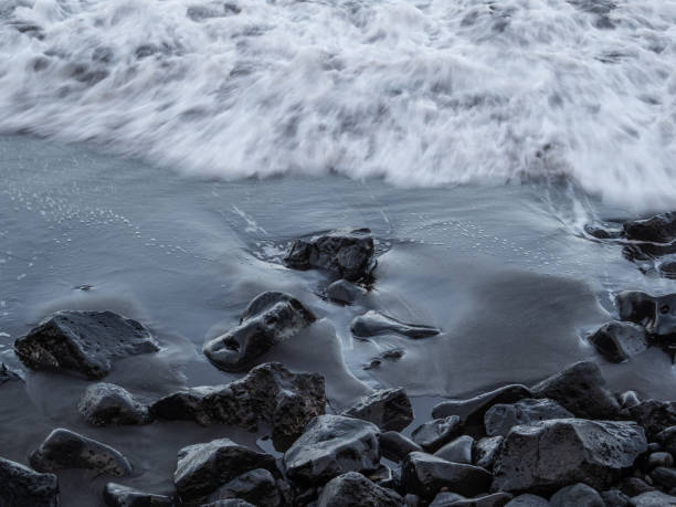 istock beach with black volcanic sand on  Tenerife 2033006846