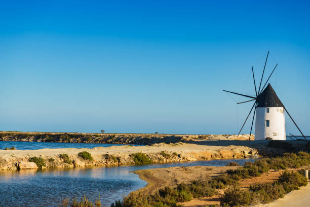 Old historic windmill in salt marshes at San Pedro del Pinatar park, Murcia Spain. Tourist attraction