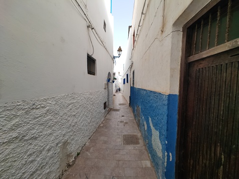The Kasbah of the Udayas is a kasbah (citadel) in Rabat, Morocco, located on a hill at the mouth of the Bou Regreg opposite Salé, and adjacent to the Medina quarter of Rabat - UNESCO World Heritage Site.\n\nPhoto depicts a Street (Rue Bazou) inside the kasbah.