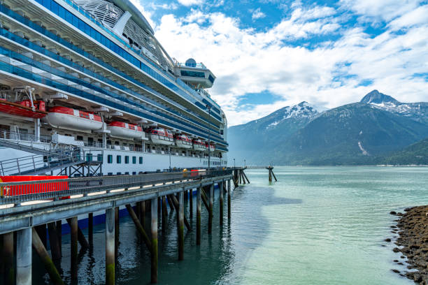 Skagway, Alaska - Aug. 5, 2023: A cruise ship is docked at Skagway pier, Alaska, USA.