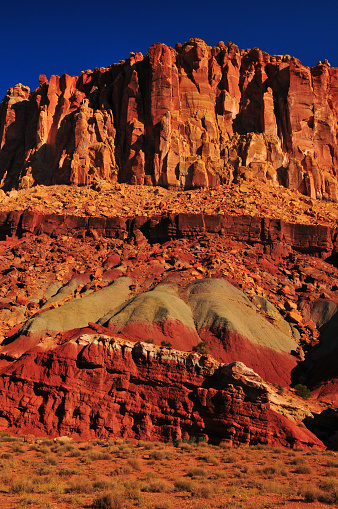 Sunrise on the spectacular geological layers of the Scenic Drive of Capitol Reef National Park, Utah, Southwest USA.