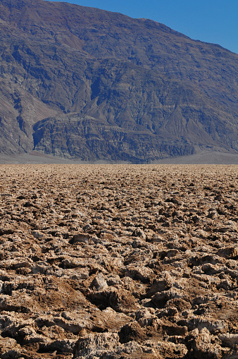 The harsh badlands known as the Devil's Golfcourse, a flat expanse of rock salt eroded by wind and rain, Death Valley National Park, California, USA.