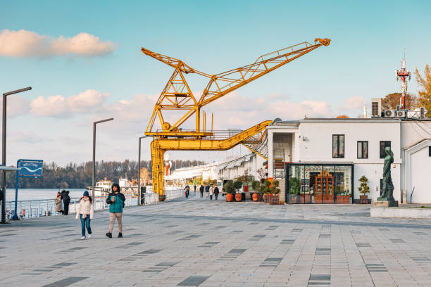 29 November 2023, Belgrade, Serbia: Explore Belgrade's dynamic waterfront promenade, where cranes symbolize industrial past of the city