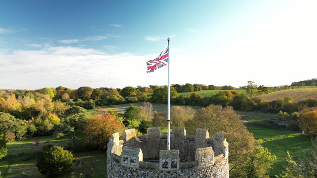 Union Jack Flag Flying above a Round Church Tower