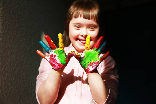 istock Cute little girl with painted hands 2033140035