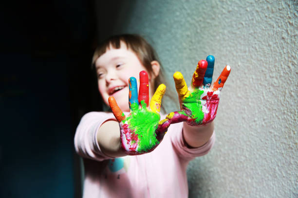 istock Cute little girl with painted hands 2033140036