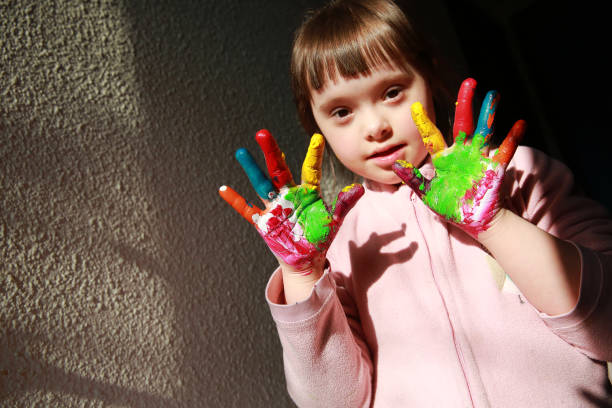 istock Cute little girl with painted hands 2033140042