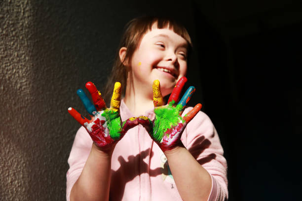 istock Cute little girl with painted hands 2033140043