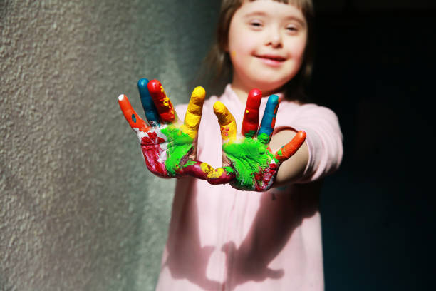 istock Cute little girl with painted hands 2033140049