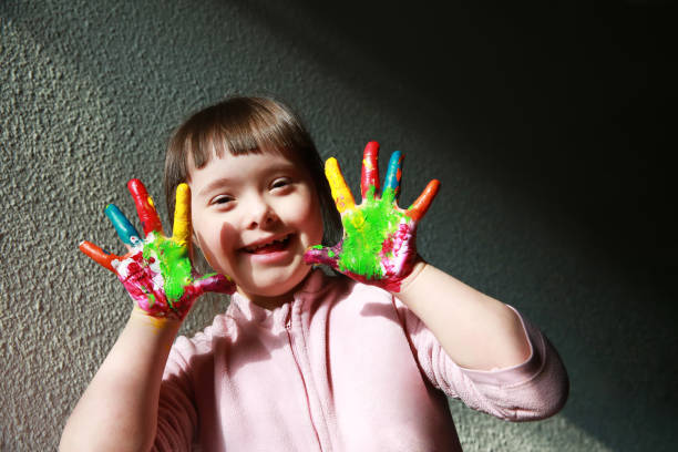 istock Cute little girl with painted hands 2033140059