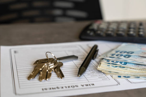 istock Turkish lease agreement form with pen and keys on it. 2033160784
