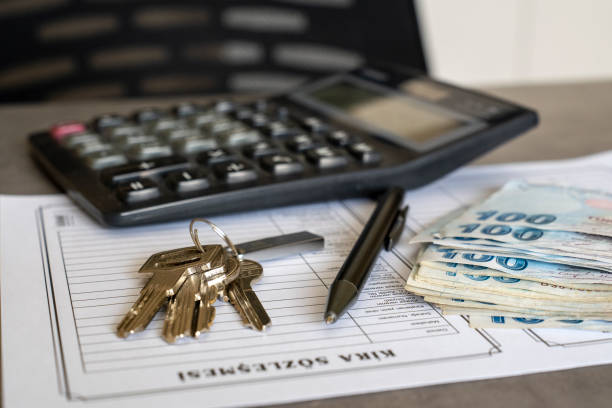istock Turkish lease agreement form with pen and keys on it. 2033161325
