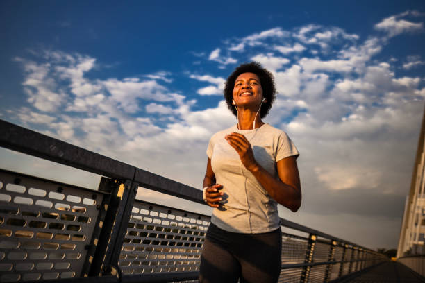 istock Young Black Woman Exercising on the Bridge 2033167386