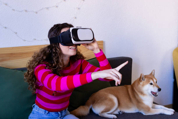 istock Woman enjoying virtual reality with pet dog 2033178995