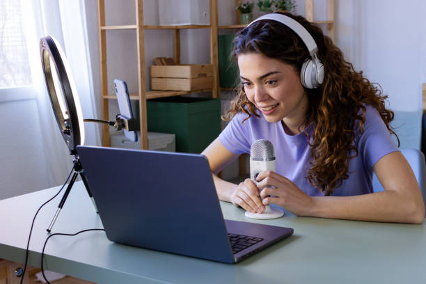 istock Smiling Podcaster During Home Recording Session 2033191453