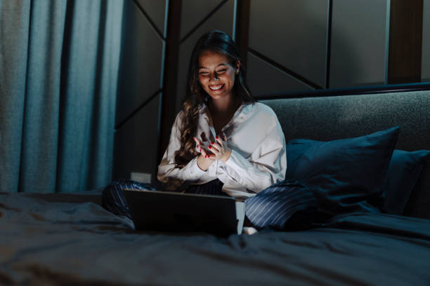 istock Woman working and using laptop at night 2033193636