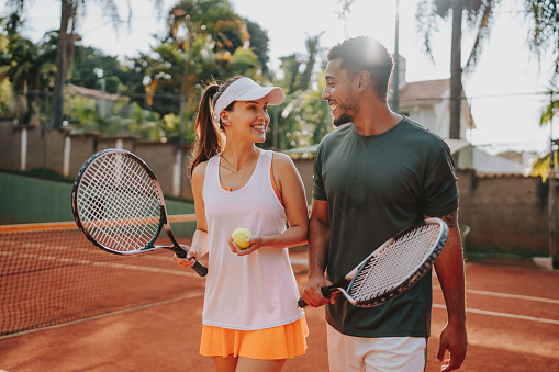 Couple playing tennis on the court
