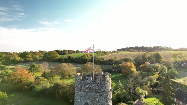 (dolly out) The Union Jack Flag on top of a Round Church Tower