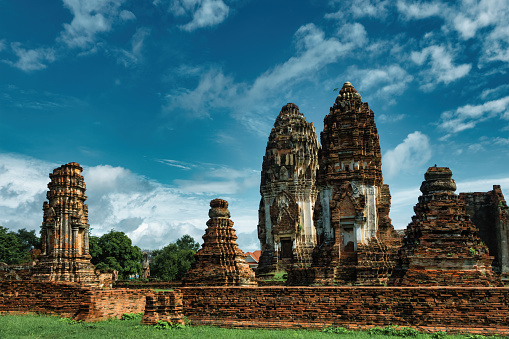 12th century ancient Wat Phra Si Rattana Mahathat temple in Lopburi, Thailand on a cloudy day.