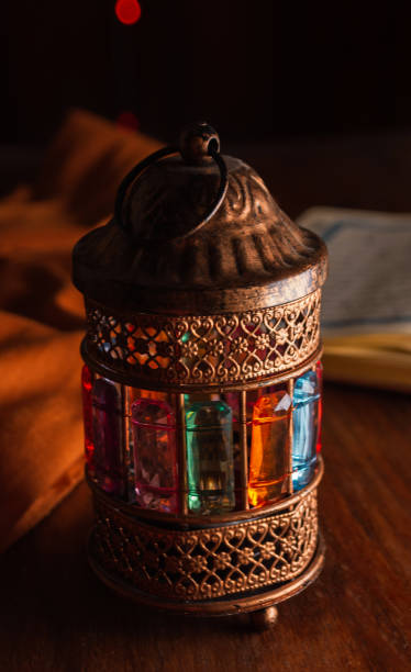 istock Ramadan lantern on wooden table with Quran 2033283884