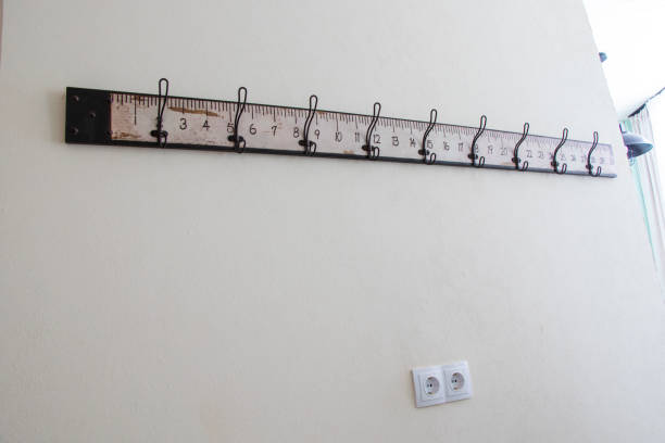 istock a long and narrow ruler hanging from the wall over a door 2033340014