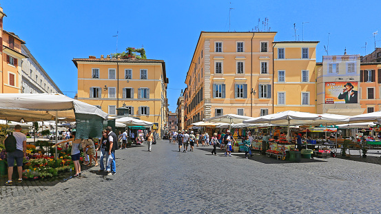 Rome, Italy - June 29, 2014: Market Stalls Selling Flowers and Produce at Campo de Fiori Square Summer Day in Capital City.