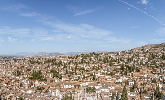 Panoramic ultra wide angle view of the Albaicin district in Granada, Andalusia, Spain, historical old town, white houses, summer tourism vacation