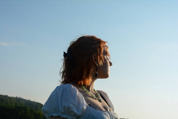 istock Young woman enjoys the sun 2033354453