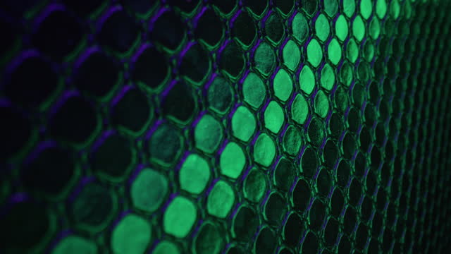 Abstract background of cells circles, glowing with green violet neon light, snake skin texture