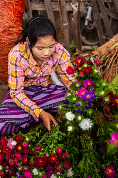 istock Burmese woman selling flowers, Myanmar 2033393407