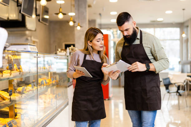 istock Mid audlt  startup partners taking online orders, pastry, and bakery food shop 2033394464