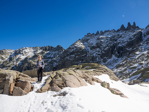 Mittelberg, Austria - June 25, 2020: Rope team mountaineering with crampons on glacier Taschachferner towards Wildspitze and mountain snow panorama with blue sky in Tyrol Alps. A common route to the mountain Wildspitze is via Taschachferner. This is a high mountain tour.