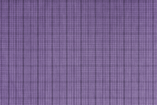 Purple checkered texture fabric, tartan pattern. Shirt fabric, tablecloth textile, linen plaid cloth, classic scottish check pattern. Backdrop, wallpaper, background.