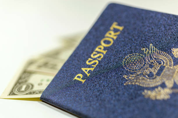 istock United States passport with dollar bills 2033406631