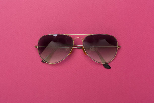 istock Sunglasses on color background, top view. 2033422774