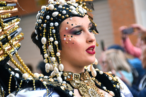 Portrait of a mid adult woman at a street carnival party