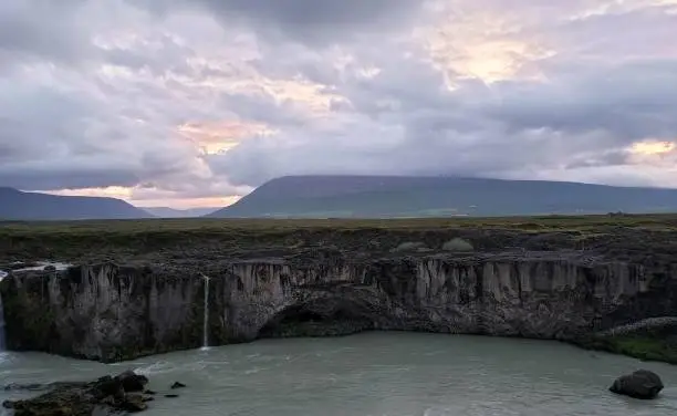 Cloudy sunset over mountains and river in Iceland