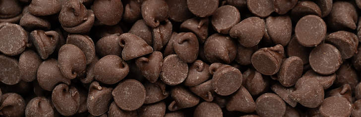 Macro panoramic photograph of chocolate chips.