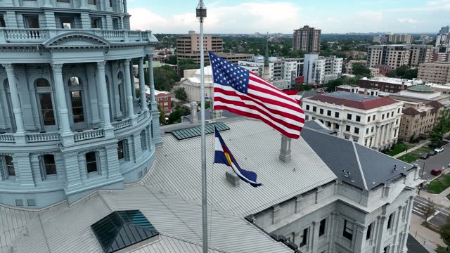 Drone Aerial Colorado State Capitol Building Flying Flags in Downtown Denver, Colorado 4K