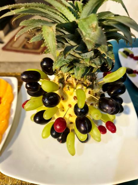 Enhancing a Pineapple with Grape and Cherry Accents: A Delightful Toothpick Creation