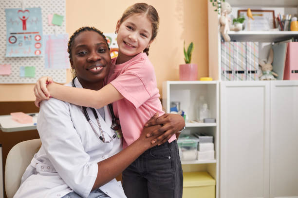 istock Doctor embracing little girl 2033567932