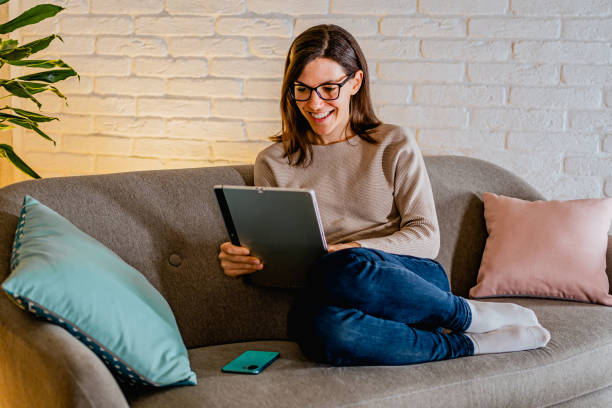 istock Woman using laptop at home 2033617301