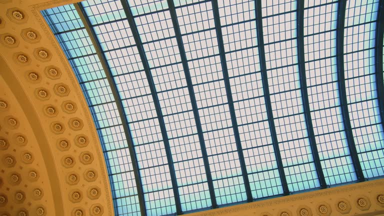 beautiful glass ceiling of old style with sky through. old union train station building in Chicago. Wide shot