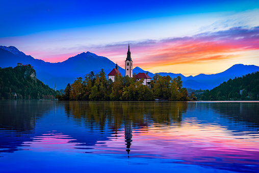 Bled, Slovenia. Morning view of Bled Lake, island and church with Julian Alps in background, Europe