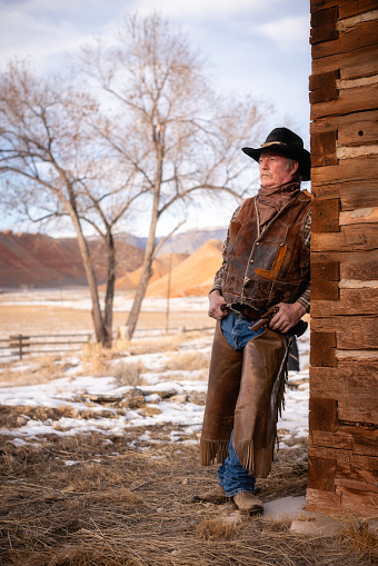 Ranch worker portrait at a Wyoming horse ranch in the winter in a rural landscape.
