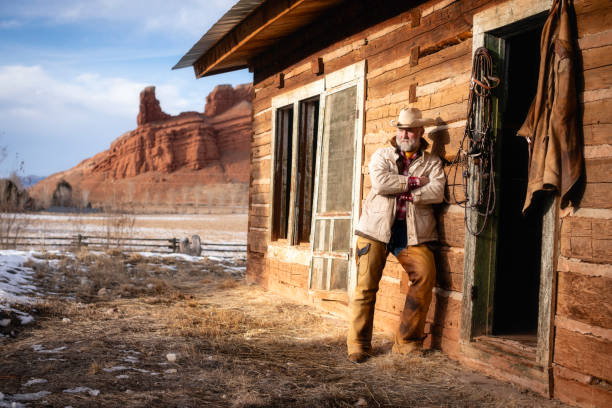 Ranch worker portrait at a Wyoming horse ranch in the winter in a rural landscape.