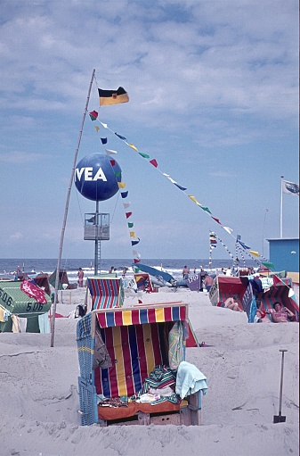 North Sea beach (unfortunately the exact location is not known), Germany, 1972. Beach chairs and vacationers on a North Sea beach.